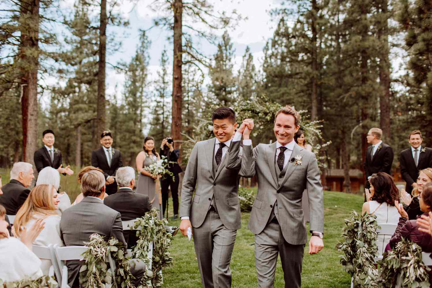 Court & Kelsey holding hands during recessional