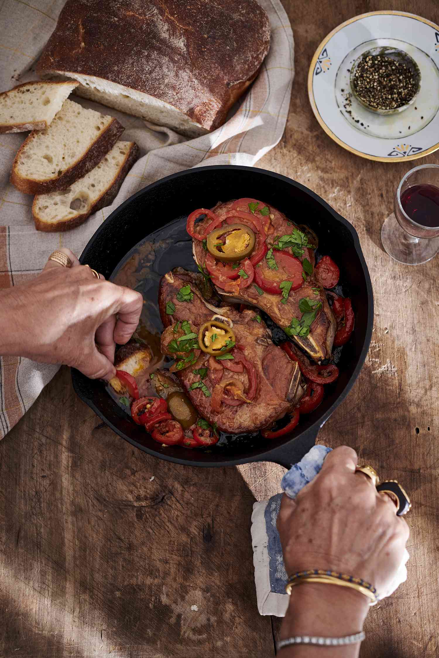 pork chops and vinegar peppers in cast-iron skillet