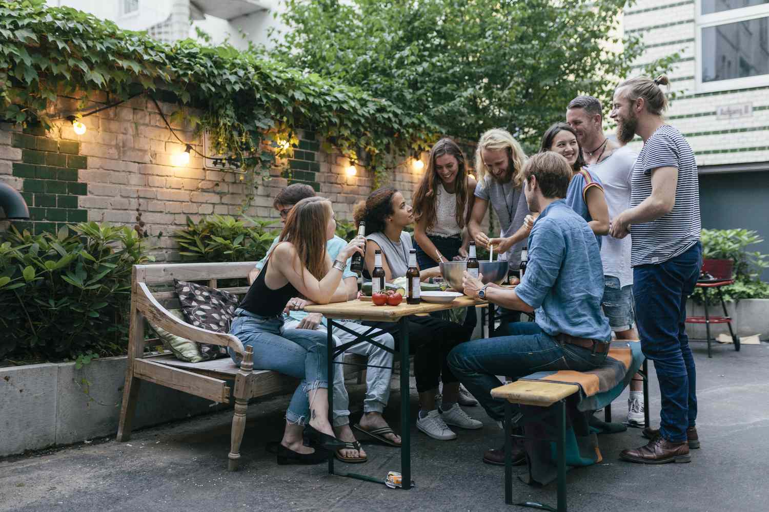Outdoor dinner party with young group of friends