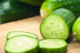 Sliced cucumbers on cutting board