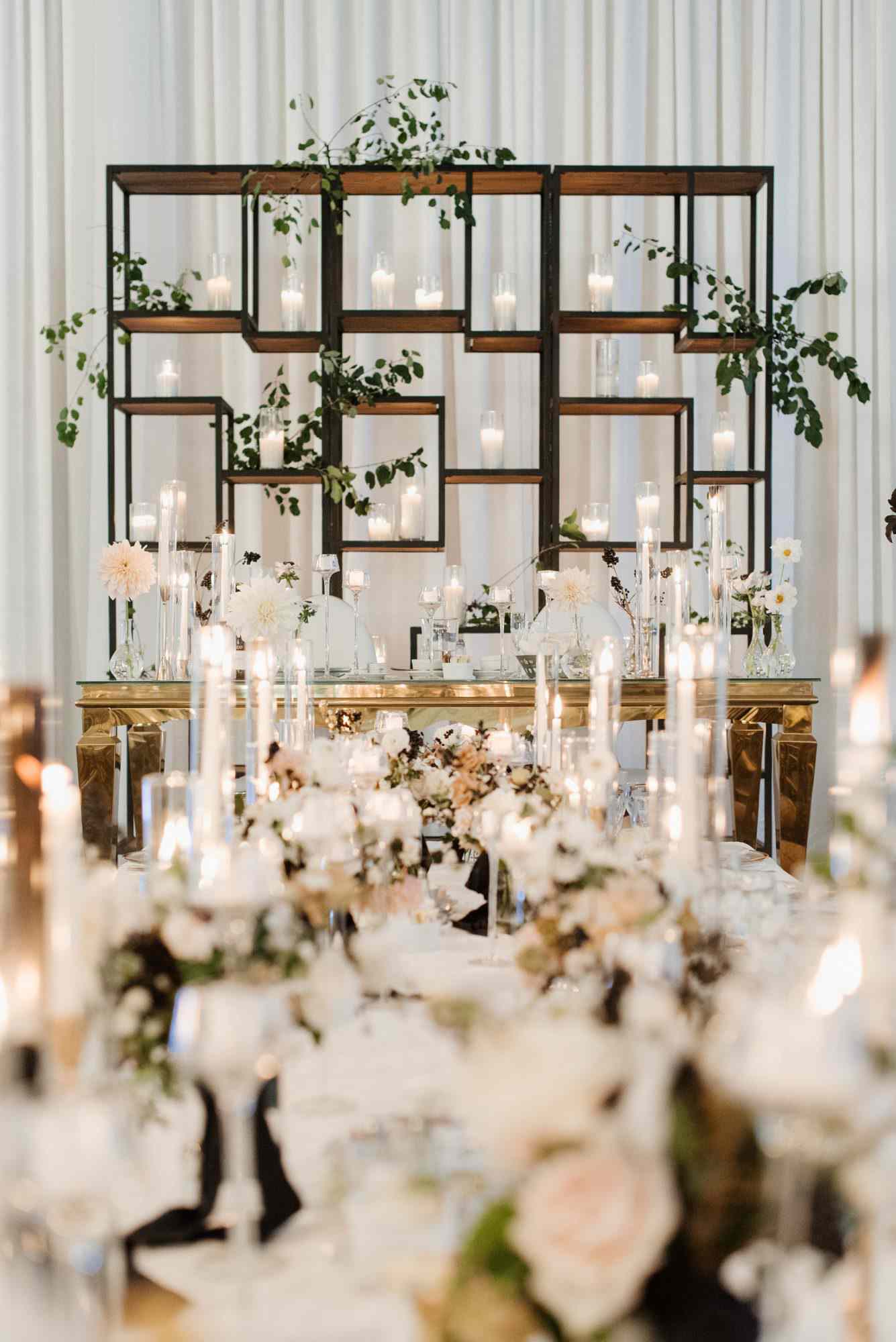 bridal table backdrop with candles and flowers