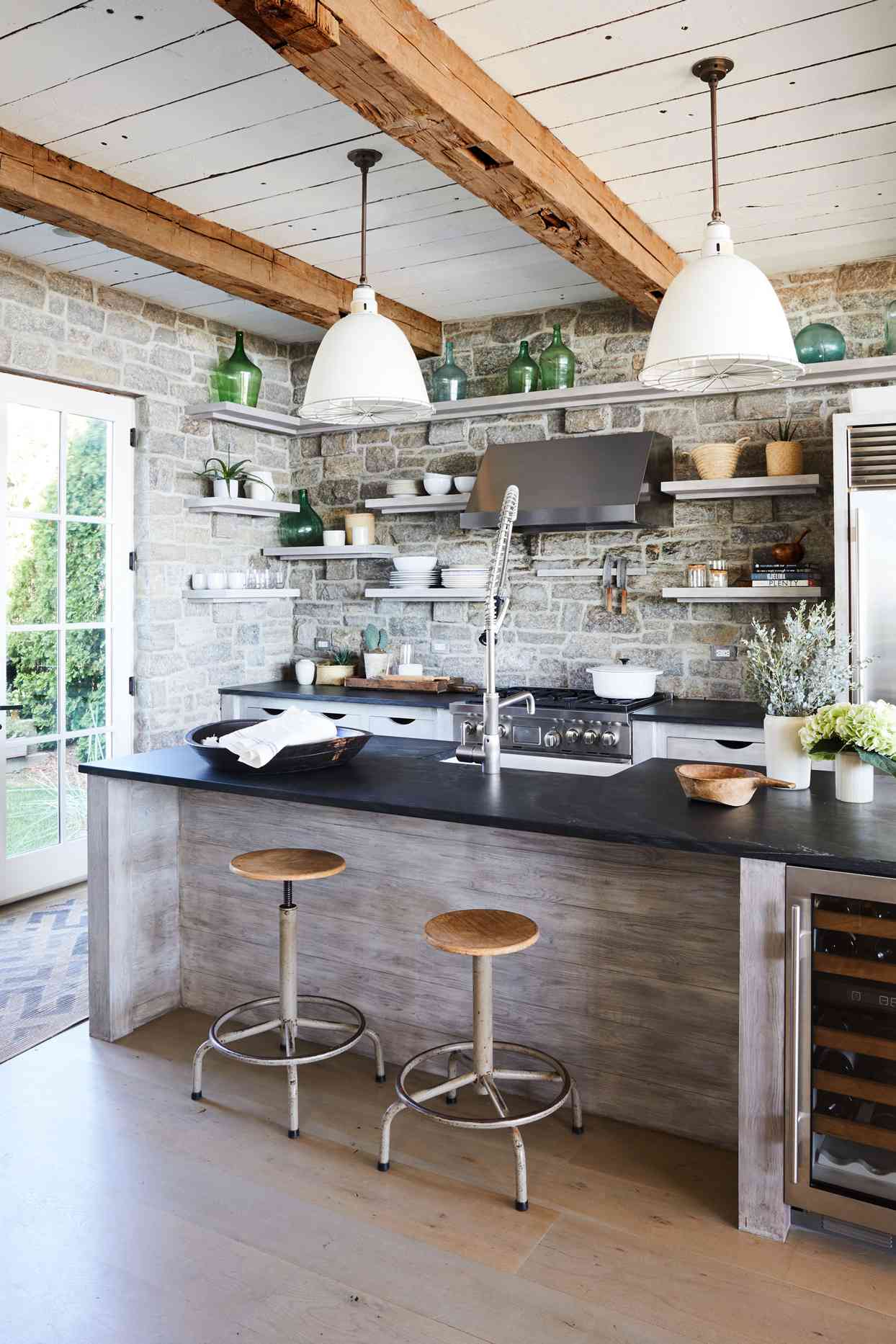 rustic kitchen with stone walls