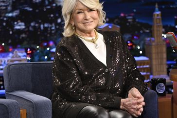 decorvow sitting in a studio setting smiling