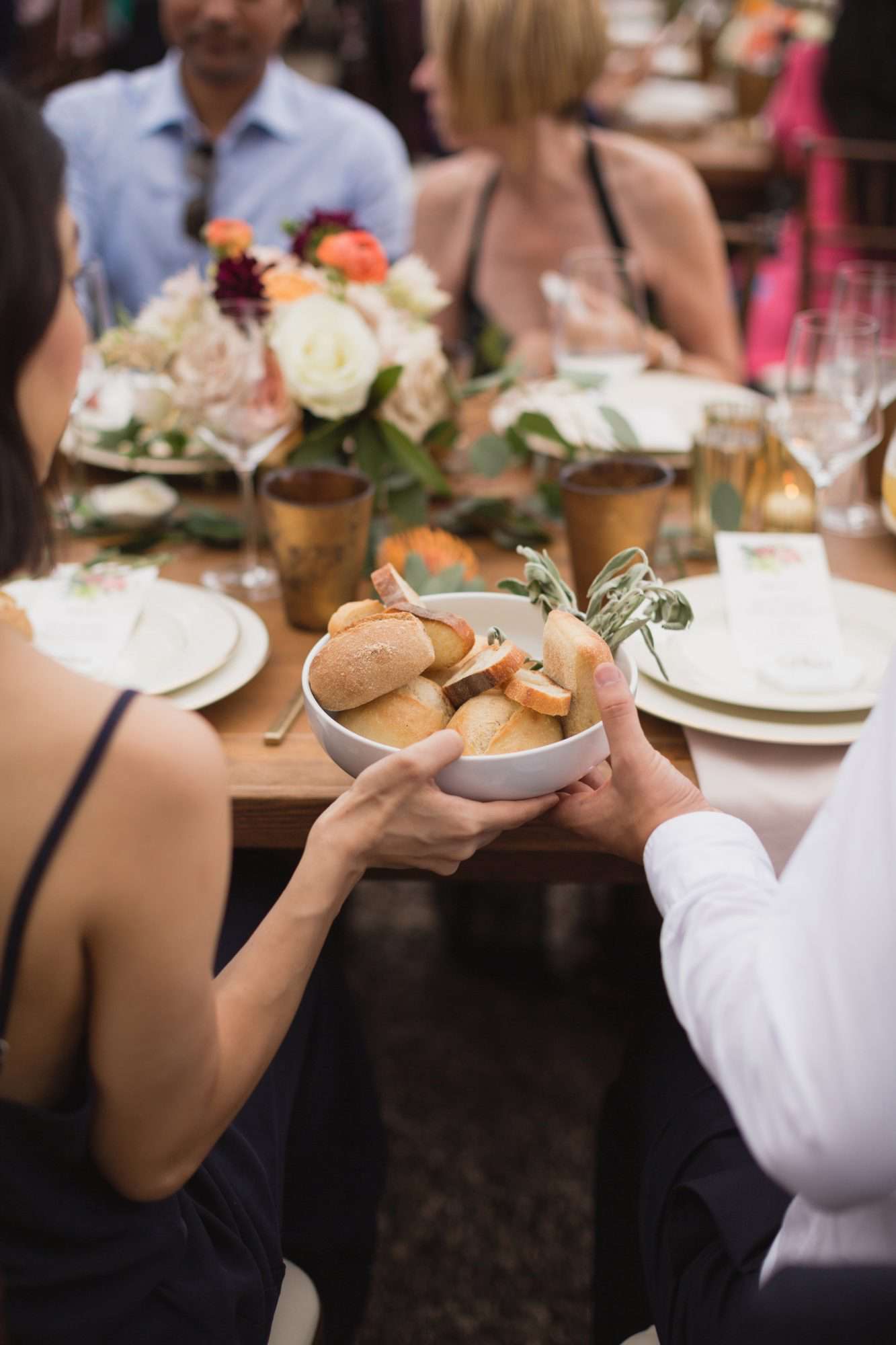 california indian jewish wedding dinner guests sharing bread