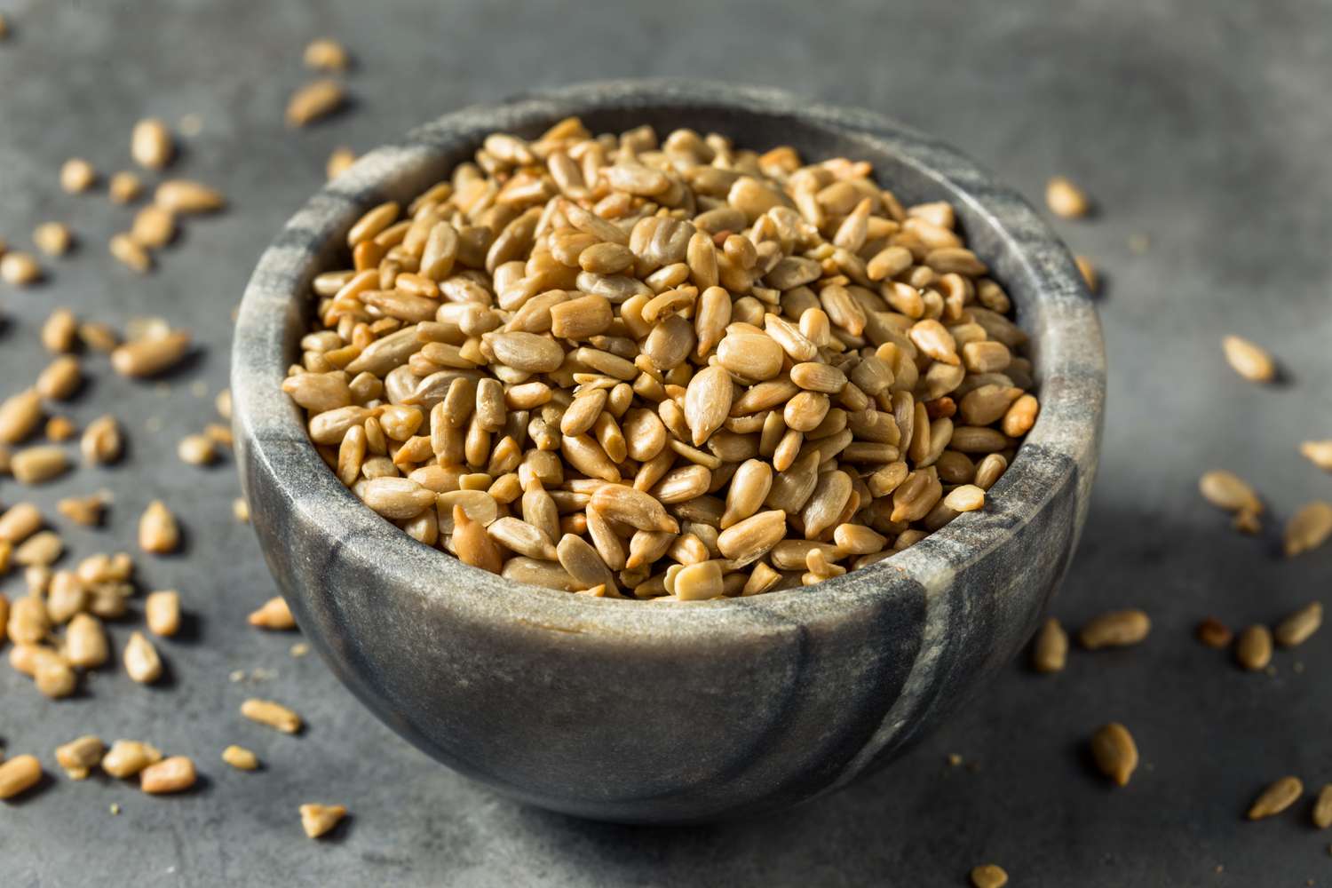 roasted sunflower seeds in a gray bowl