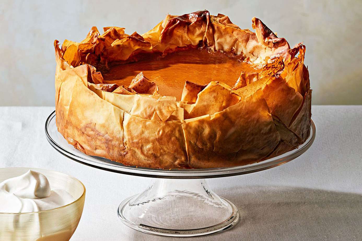 five spice pumpkin pie with phyllo crust on stand