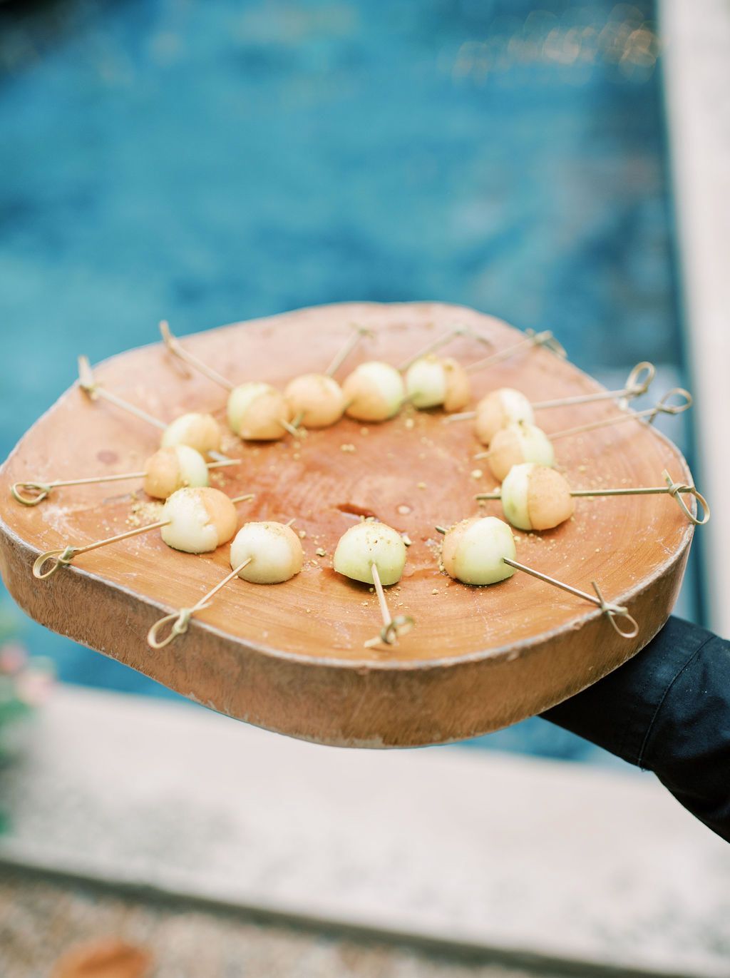 wedding cocktail hour appetizers on wooden serving tray