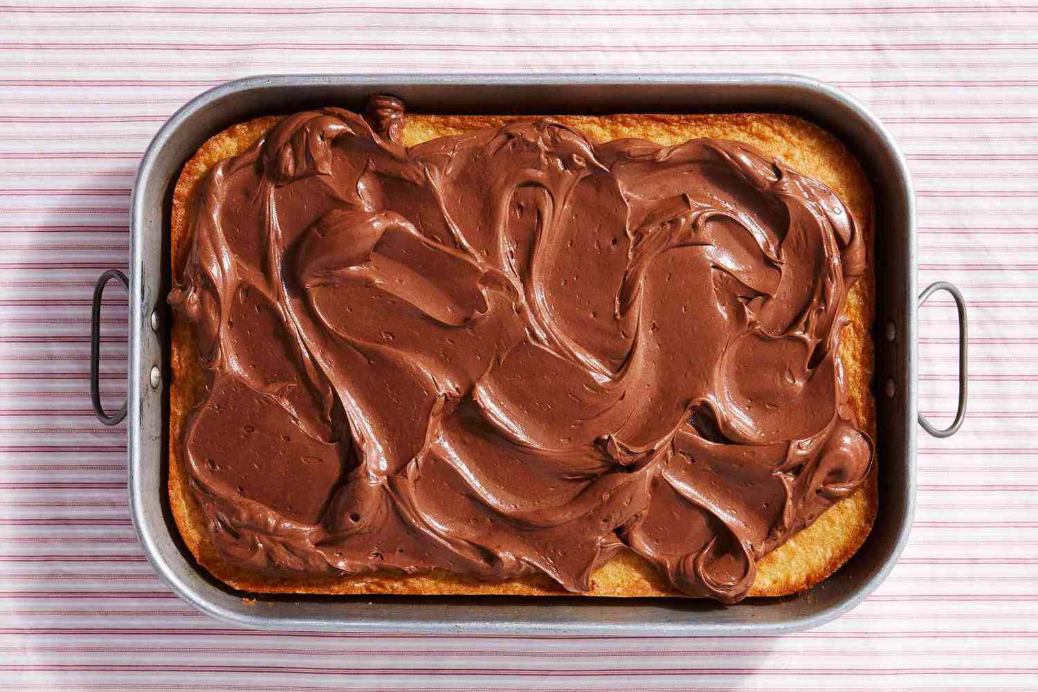 vanilla cake ganache frosting in pan