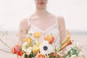 orange bouquet with calla lilies dahlias and roses