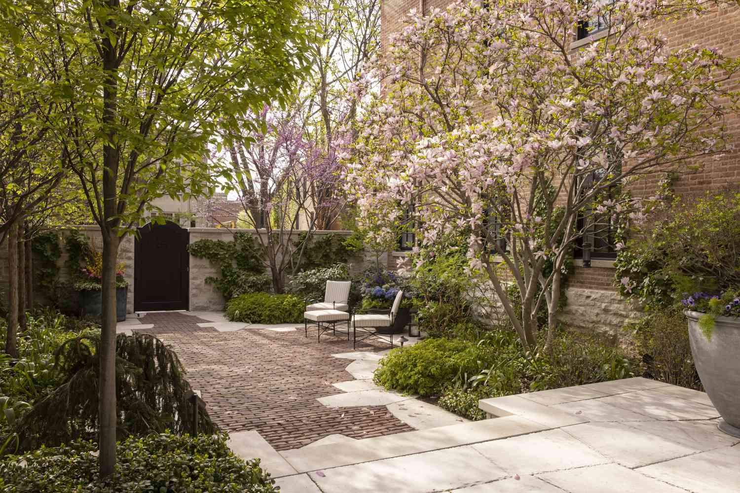 a backyard with stone walls