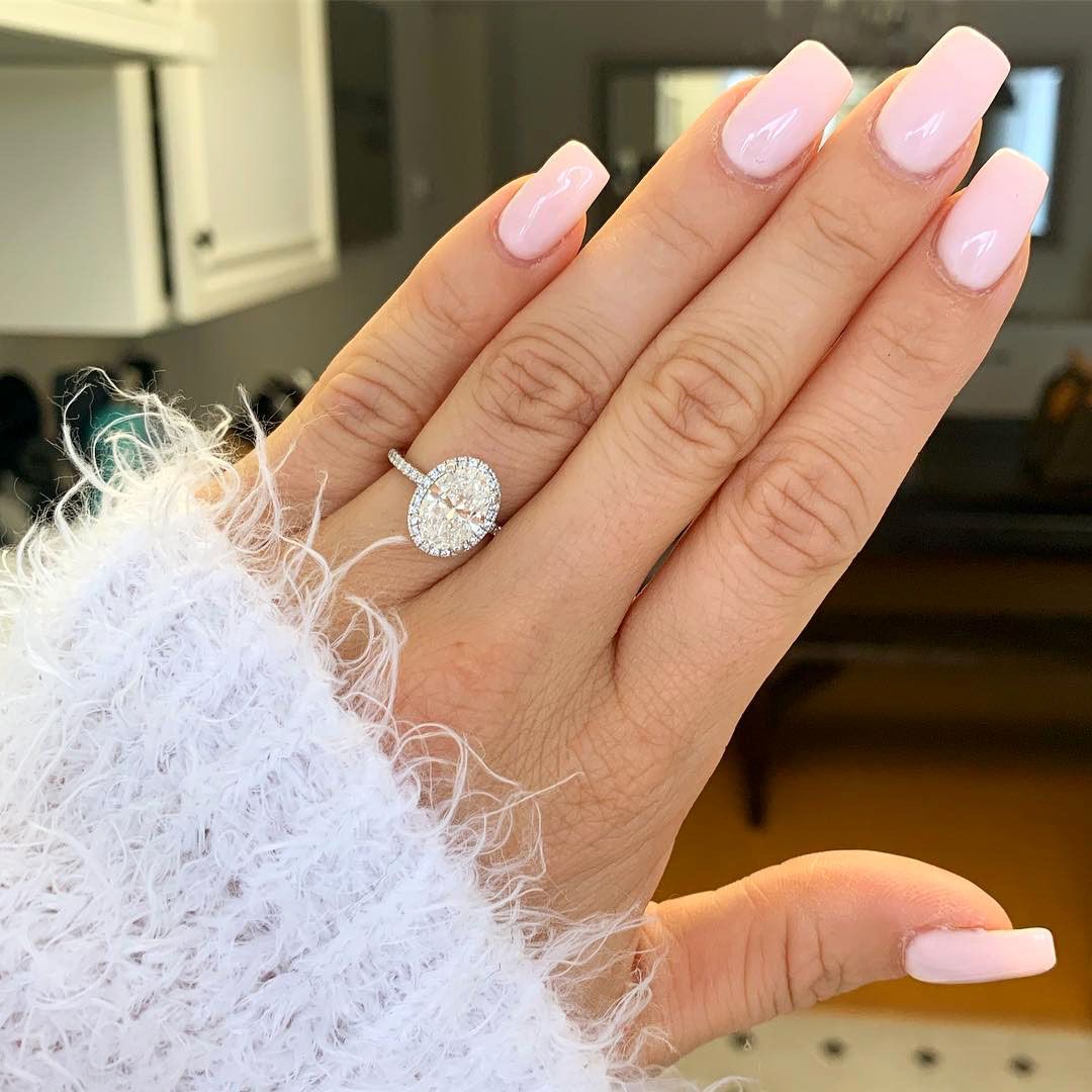 engagement ring selfie white fuzzy sweater and pink nails