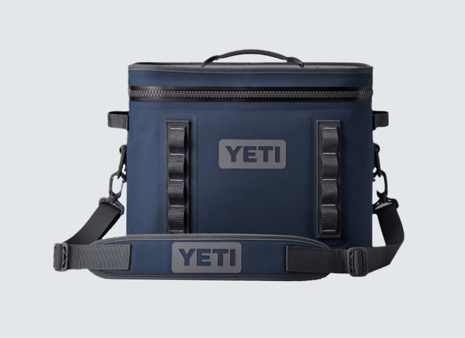 navy colored Yeti small cooler on a grey background