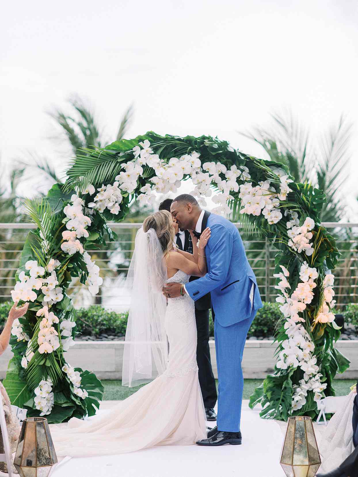 Bride and groom kissing during wedding ceremony