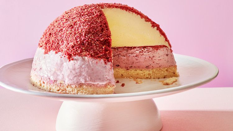cherry-cheesecake celebration bombe atop cake stand