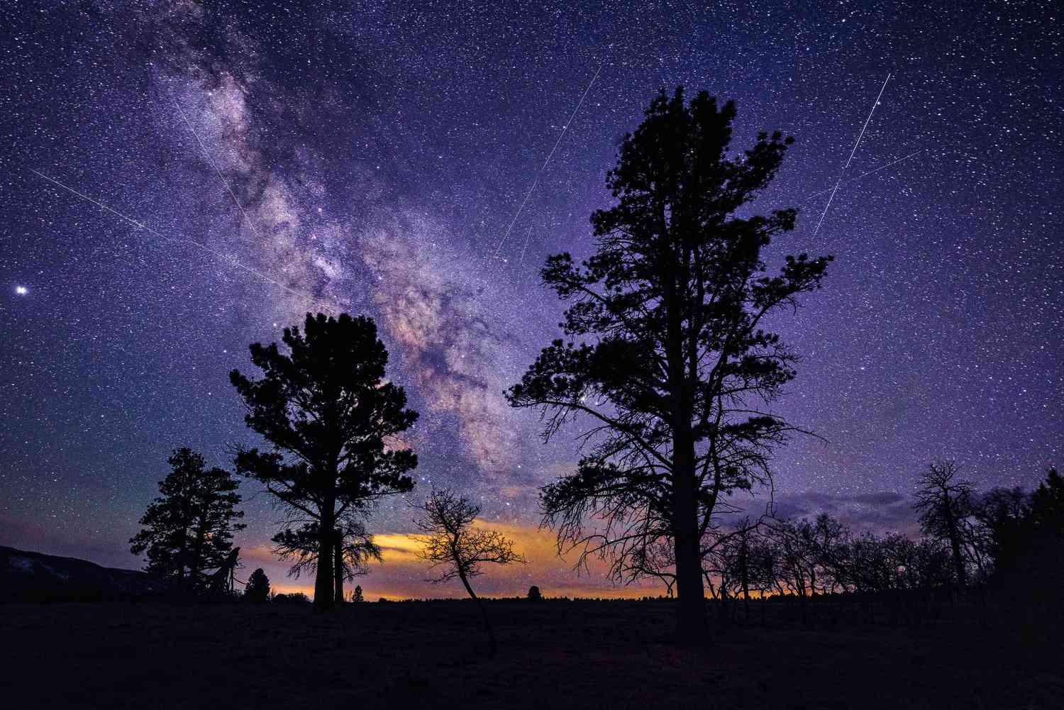 Meteors streaking across the night sky