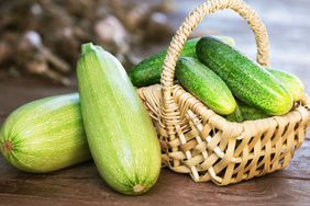 Cucumber and zucchini in basket