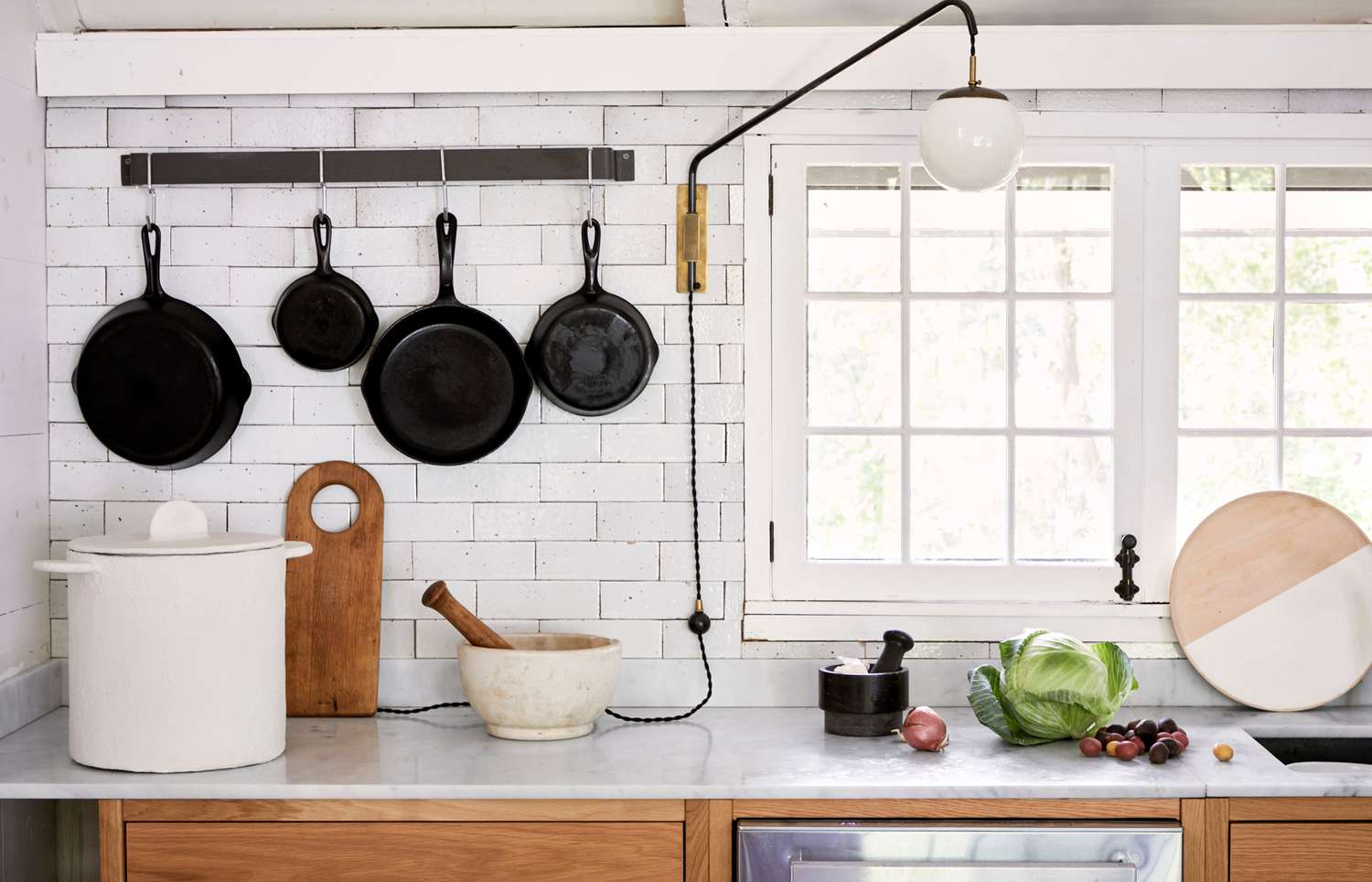 white subway tile kitchen with marble countertops