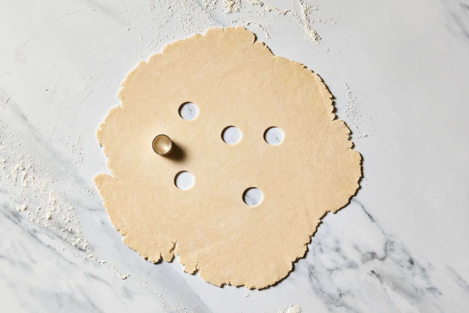 Martha's Sour Cherry Pie dough rolled out with holes