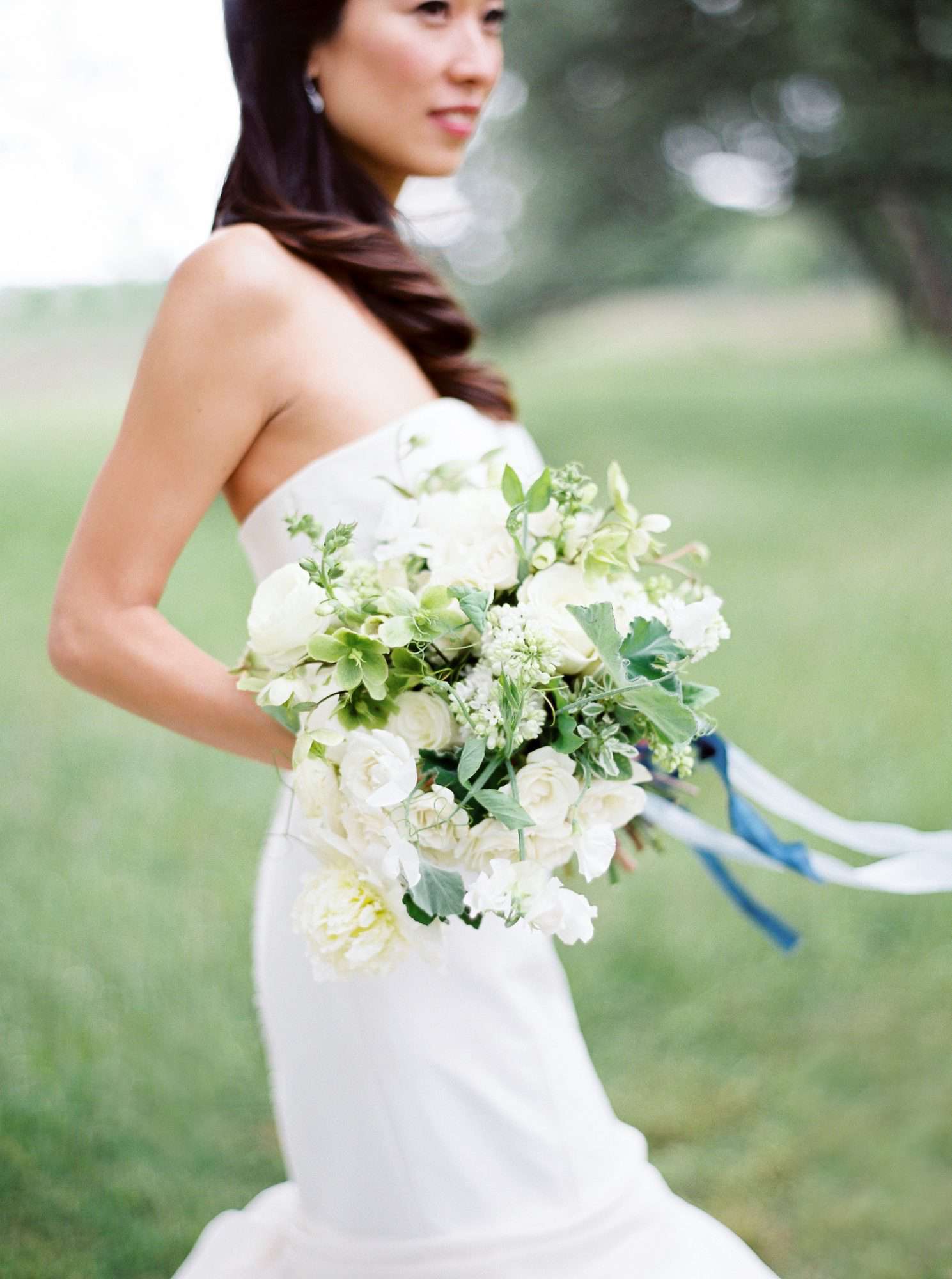 bride holding white bouquet