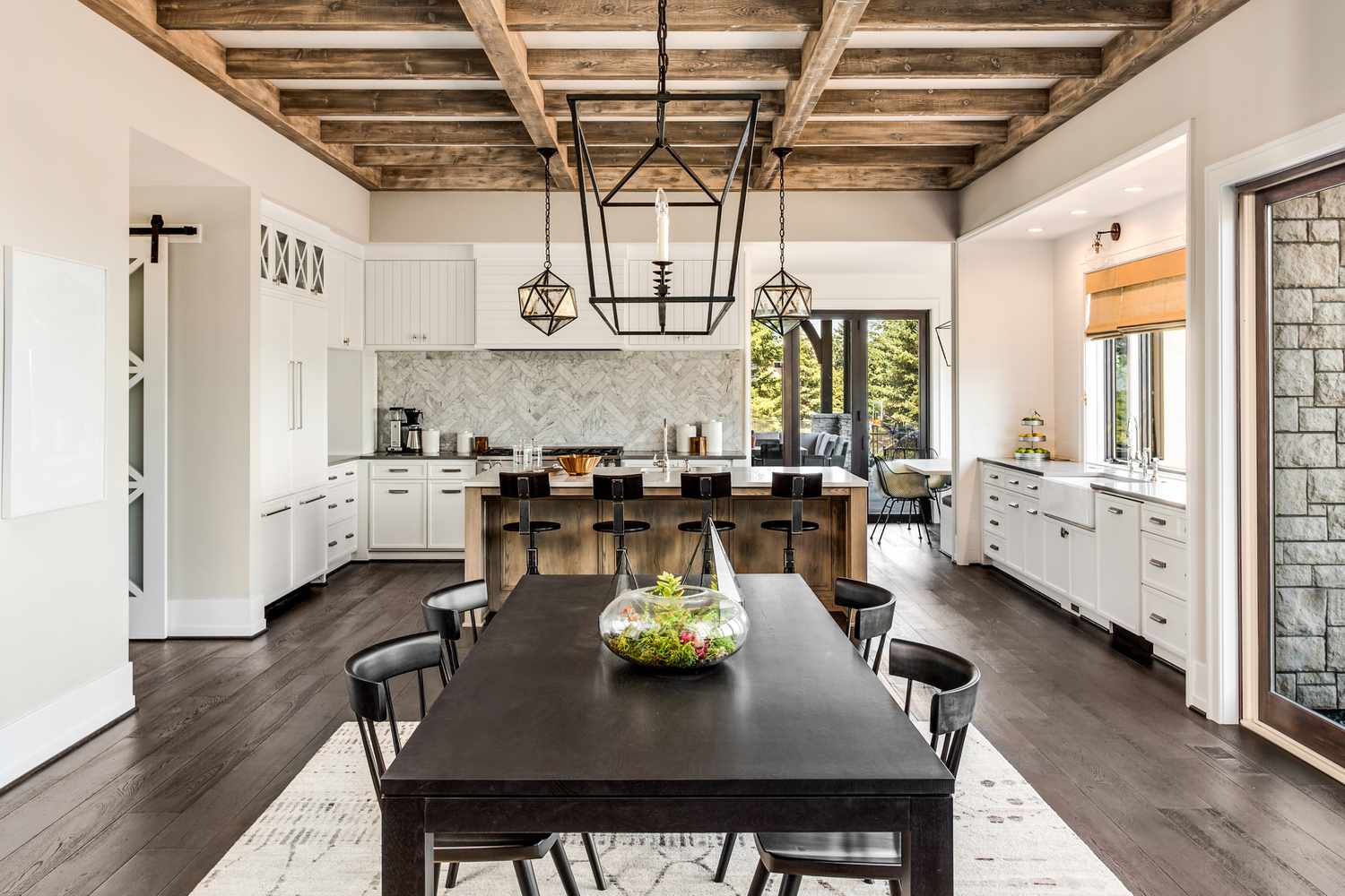 modern kitchen and dining room with light fixtures