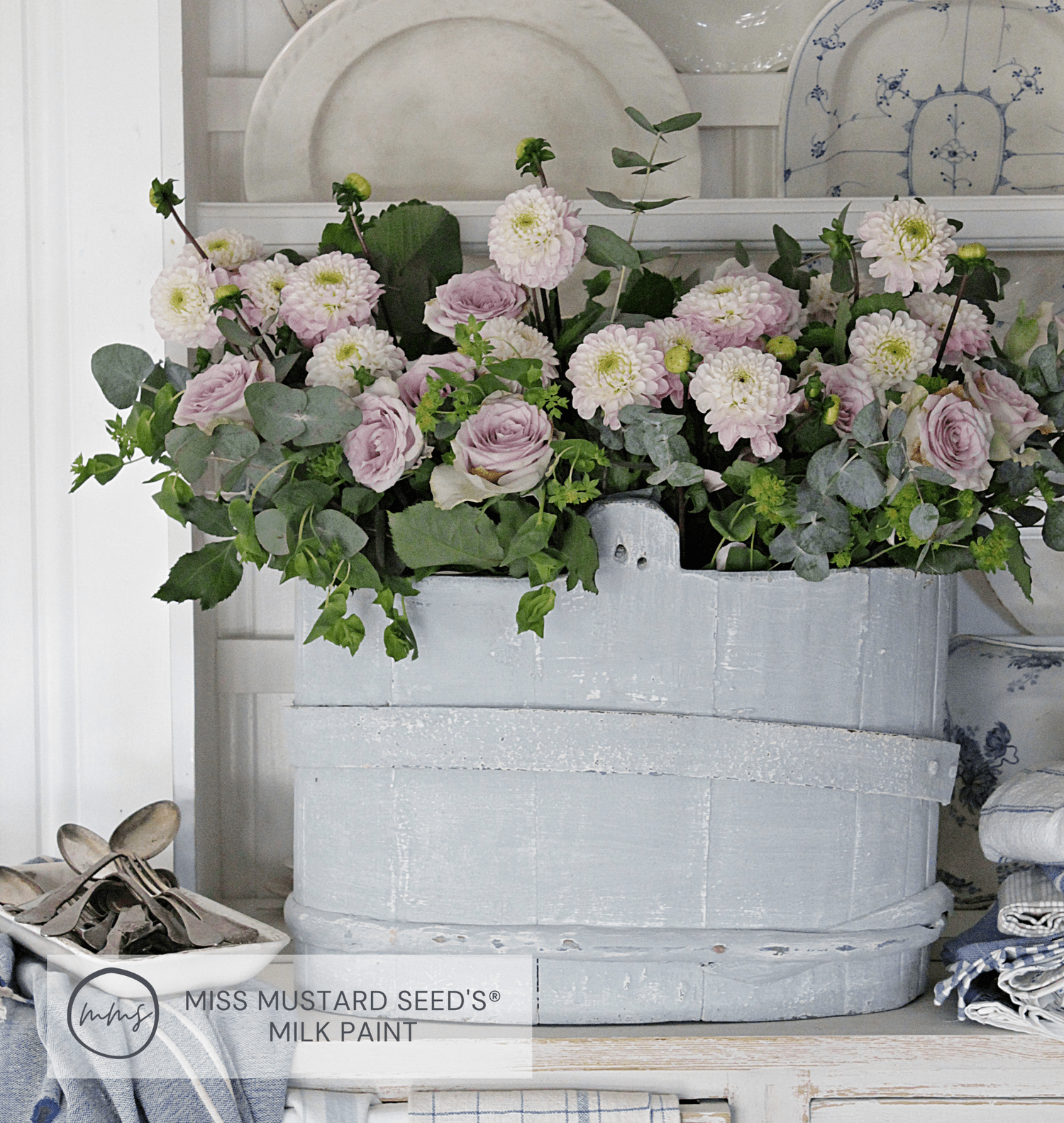 Painted bucket with fresh cut flowers