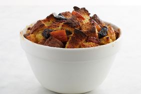 kris kringle bread pudding in a white bowl on white background
