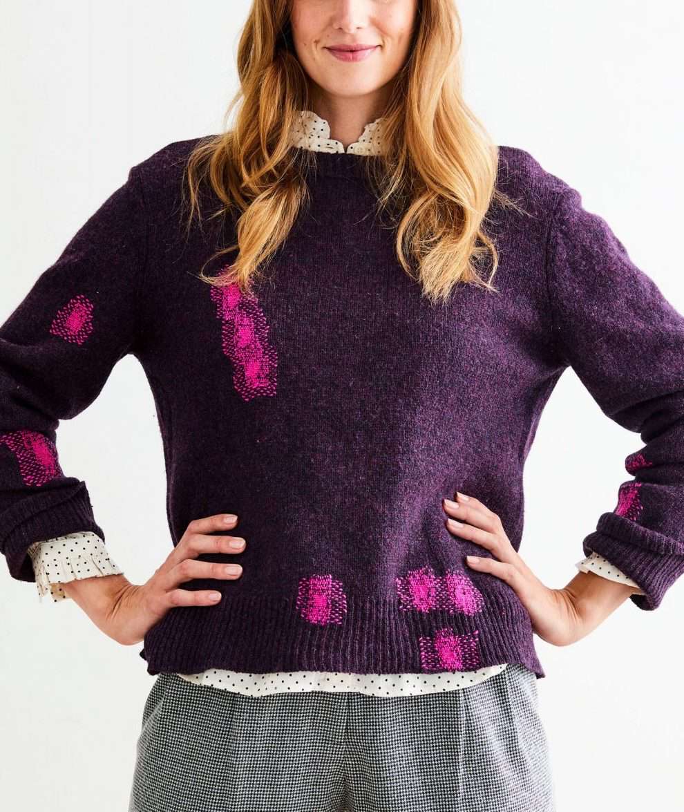 woman wearing a mended sweater