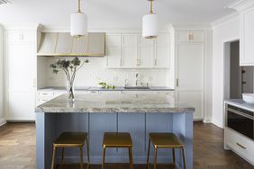 wide shot of blue and white modern, airy kitchen