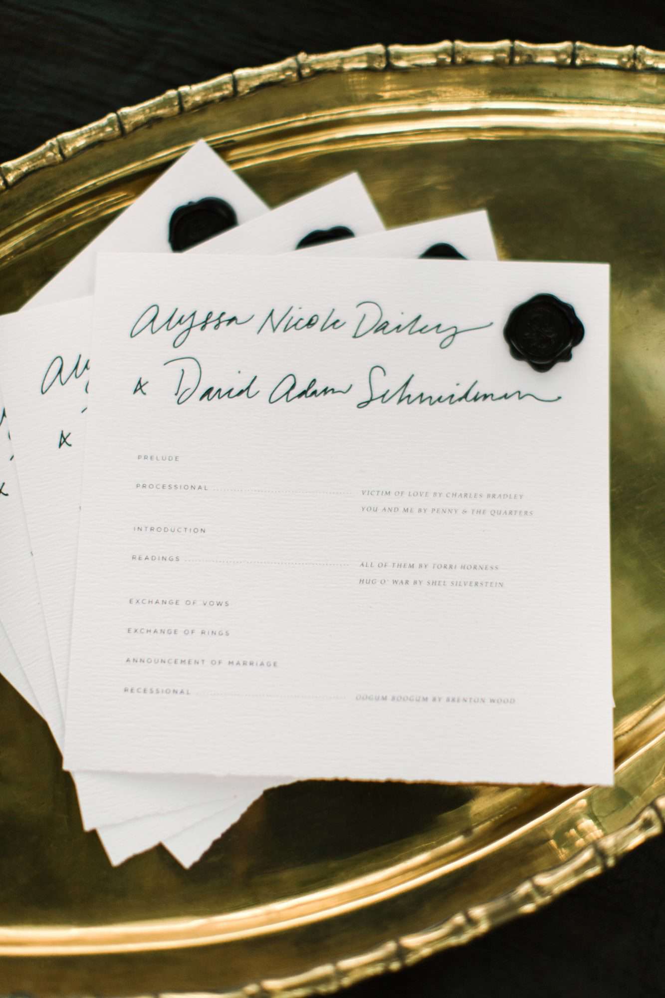 wedding programs on gold tray