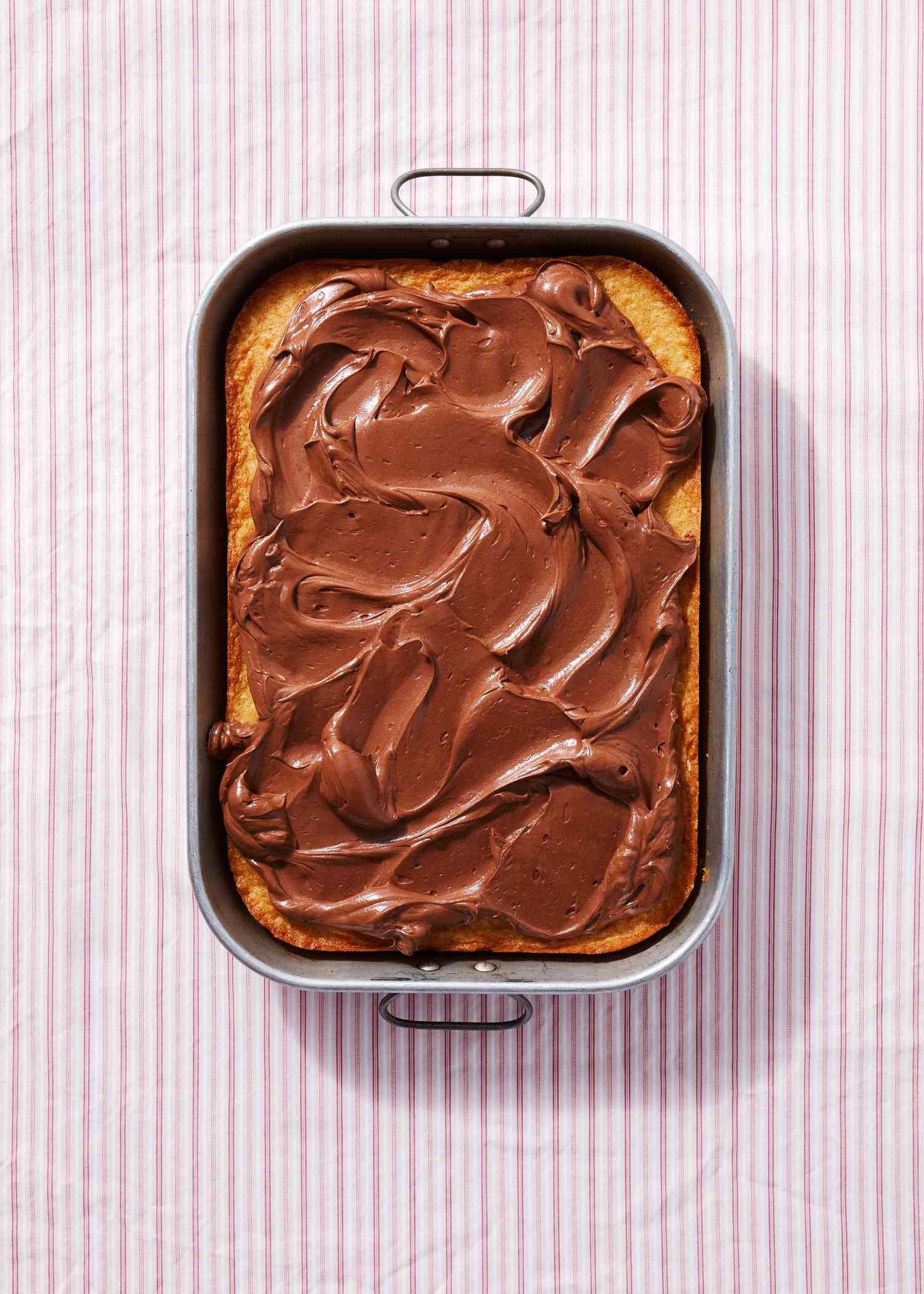 vanilla cake ganache frosting in pan