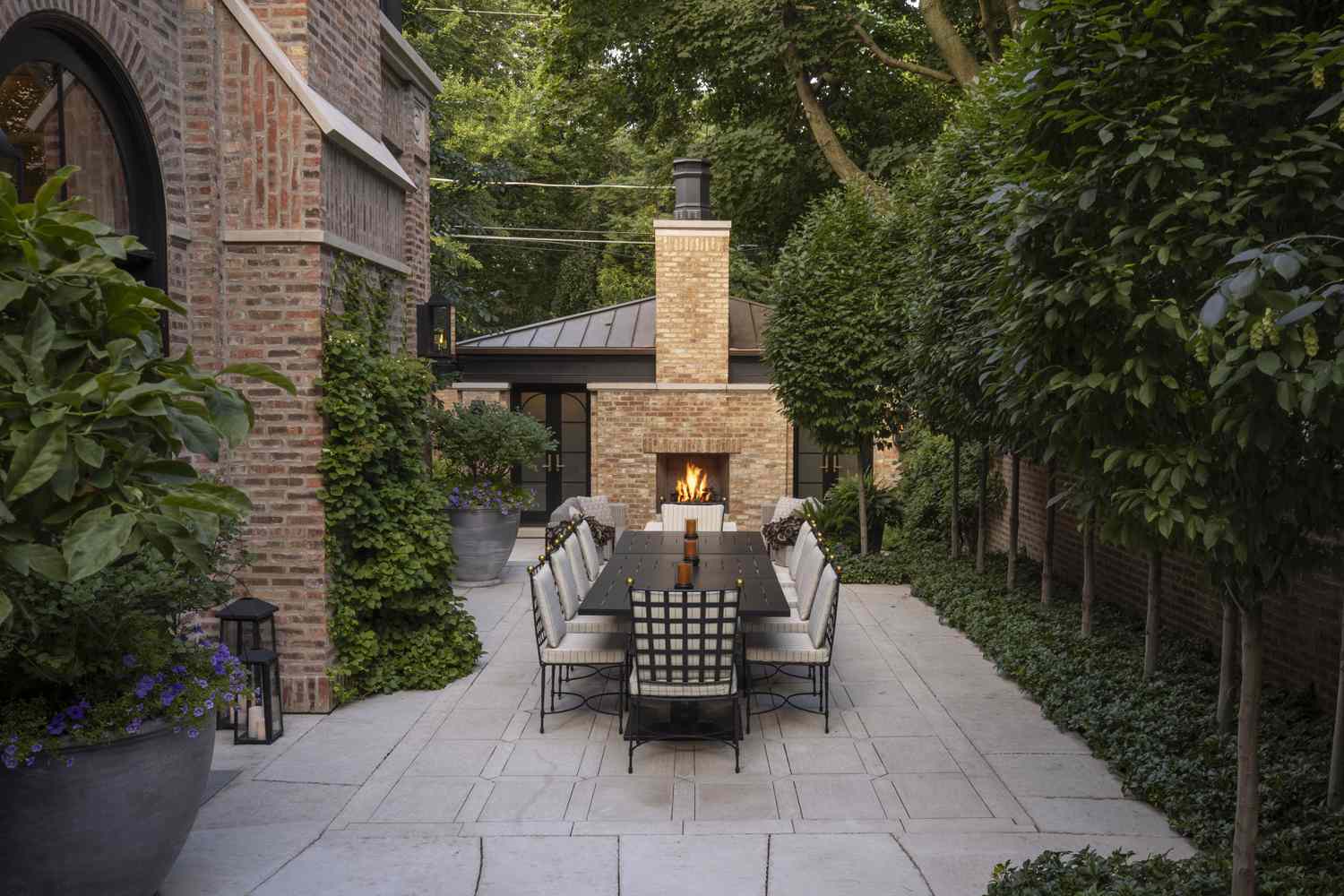 backyard with dining table and trees