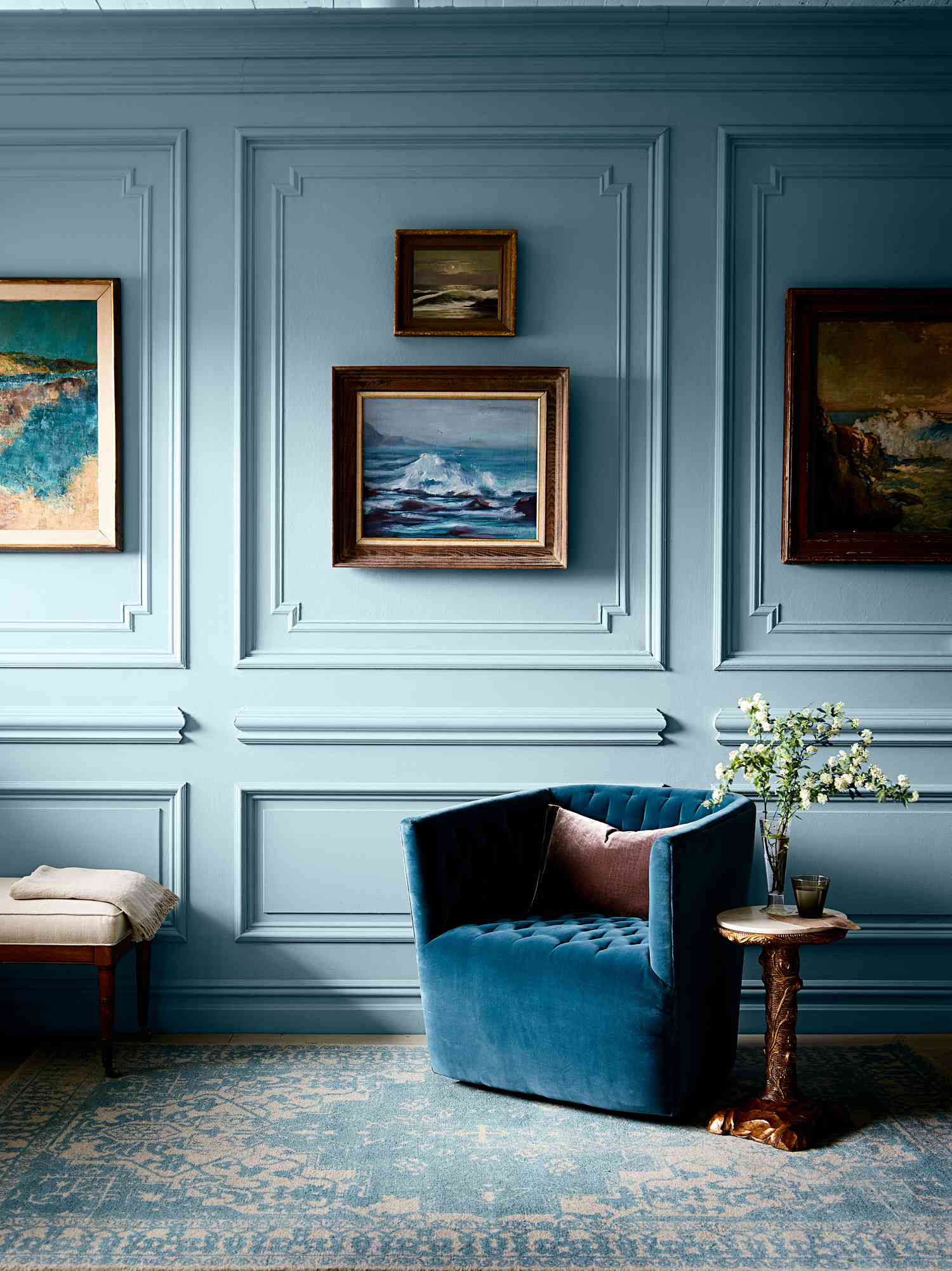 Blue room with large art 