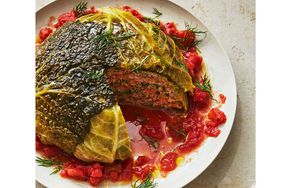 whole stuffed cabbage served on a white plate