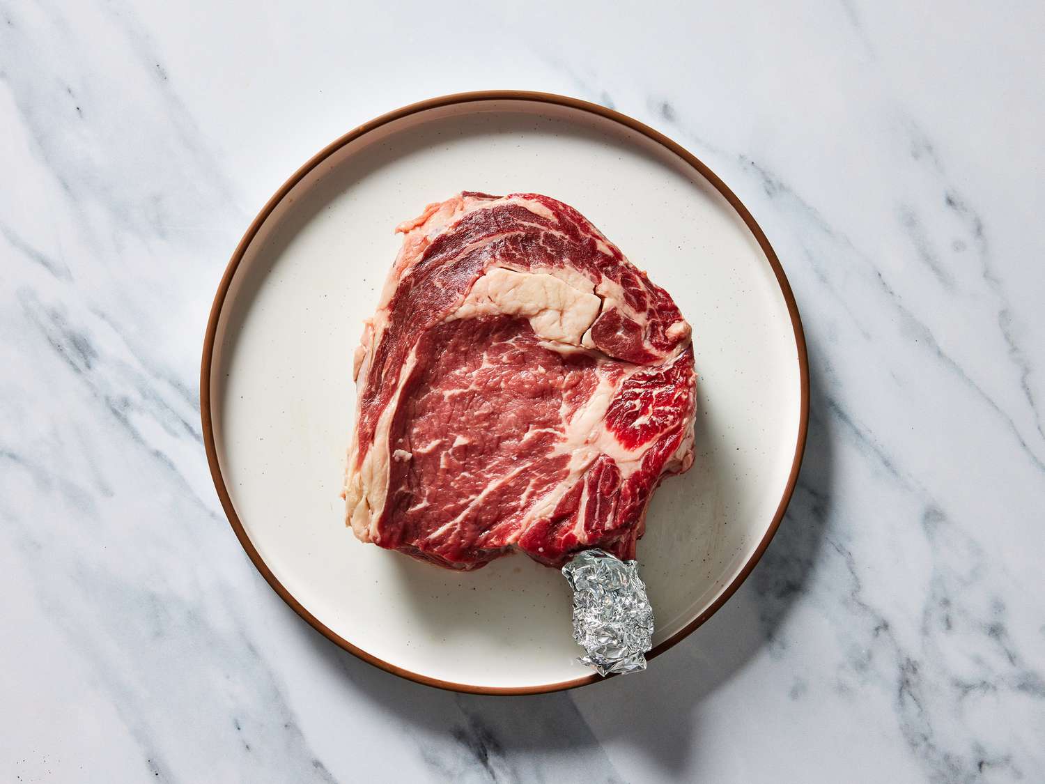 Prepping steak to be grilled