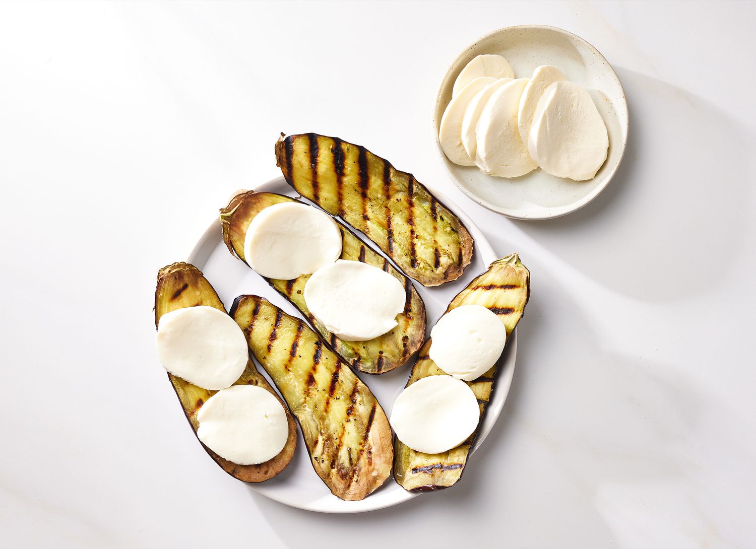 overhead view of grilled eggplant and cheese slices