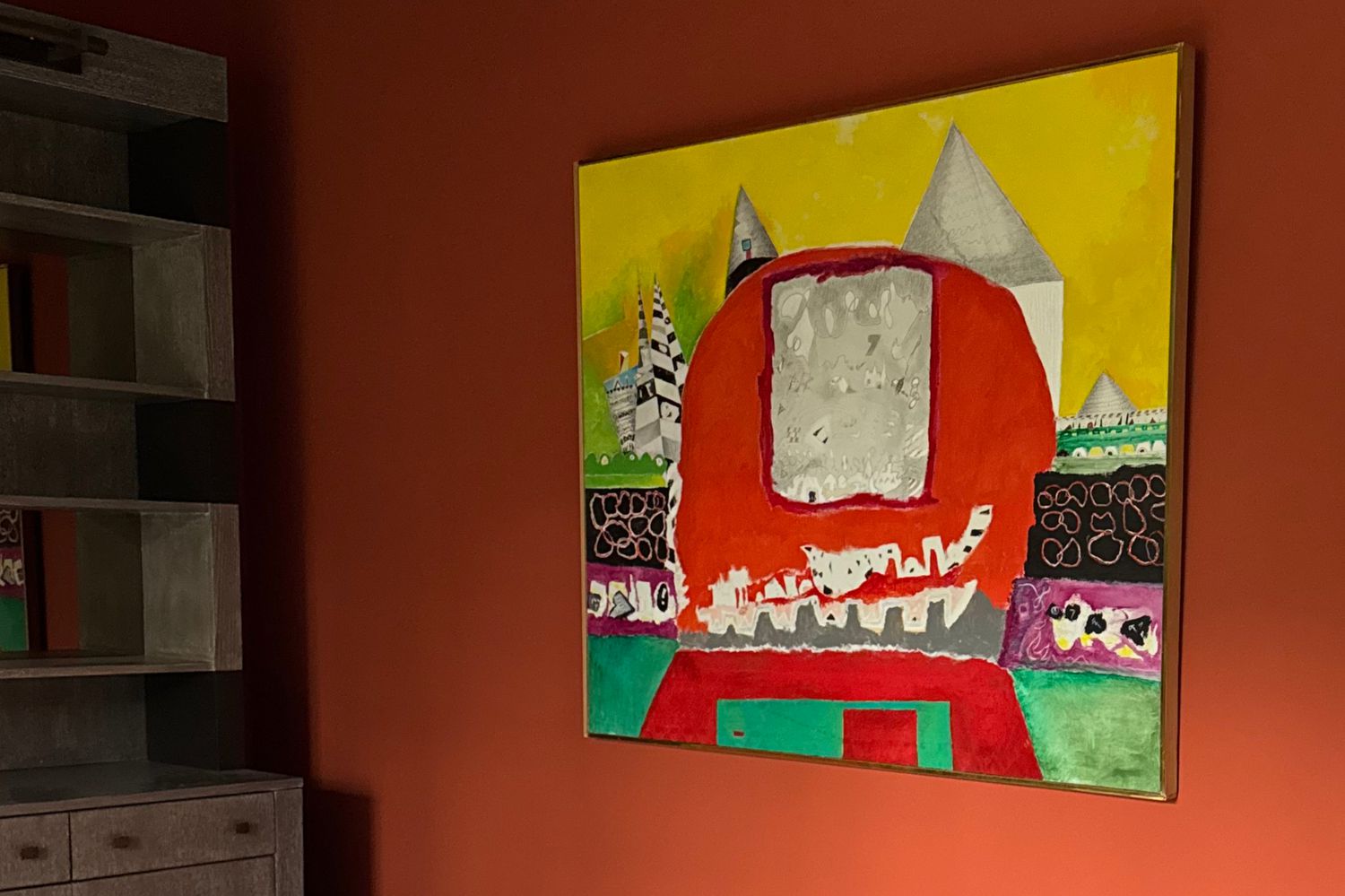 a red room with a painting