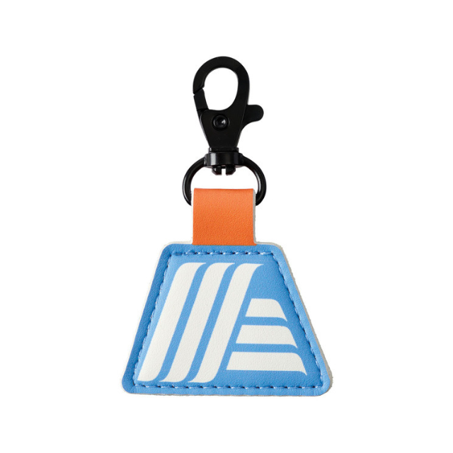A keychain with a triangular blue tag featuring a white graphic design and an orange strap with a black clip
