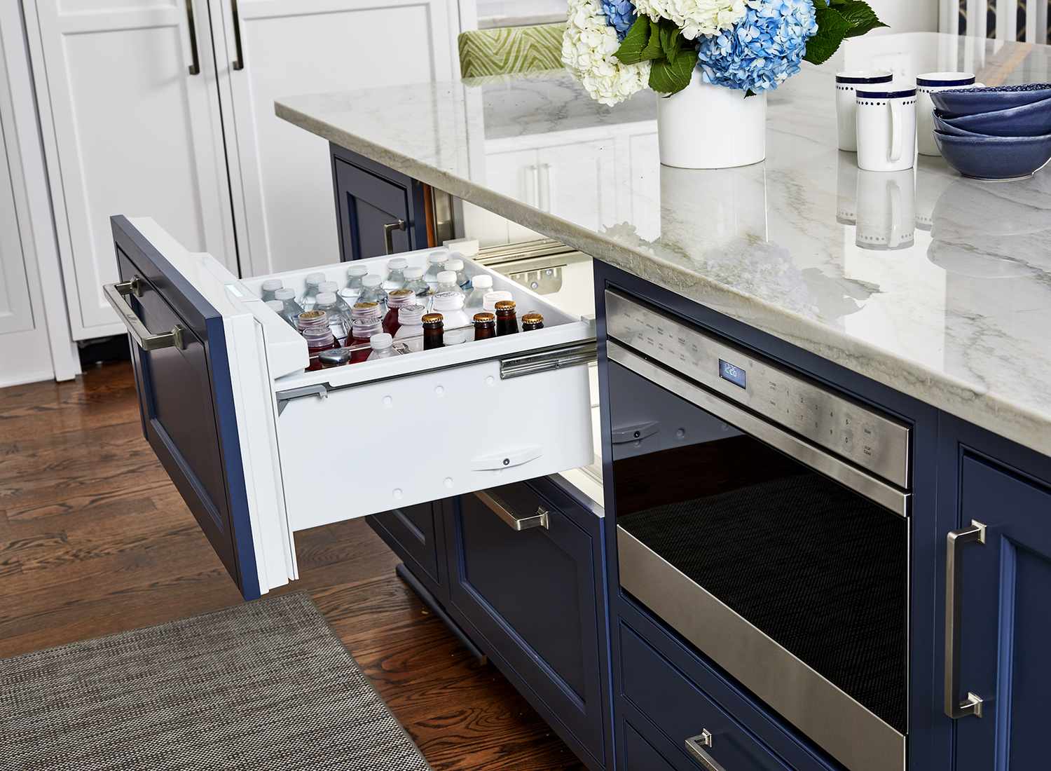 beverage storage drawer in blue cabinets