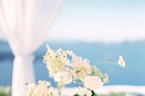 pink roses and white flowers in glass vases