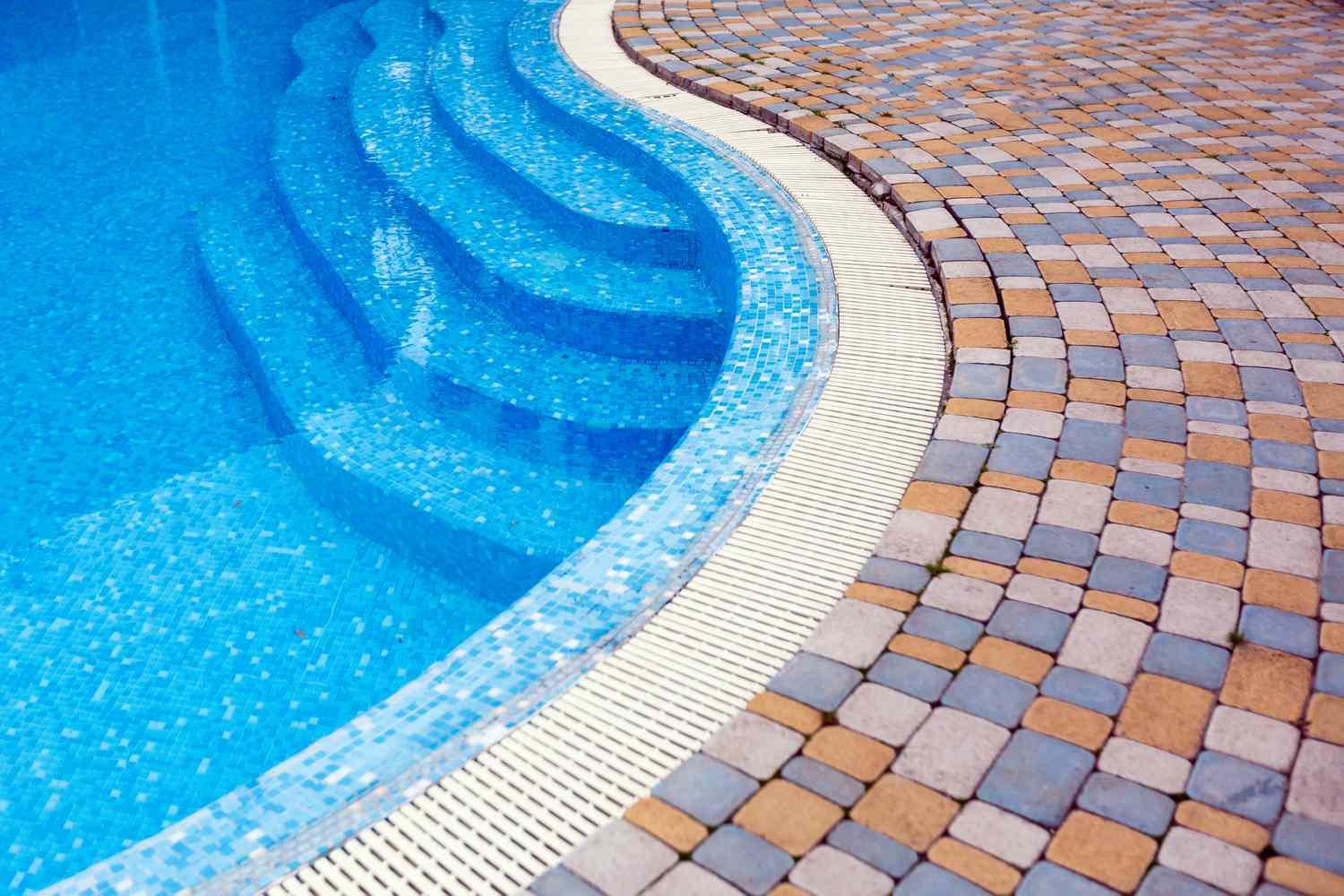 Swimming pool steps and adjacent tiled area