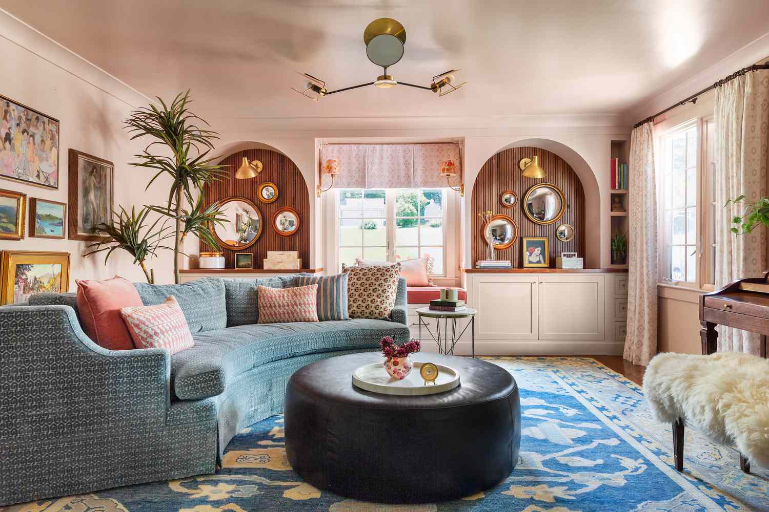 pink walls with blue sectional