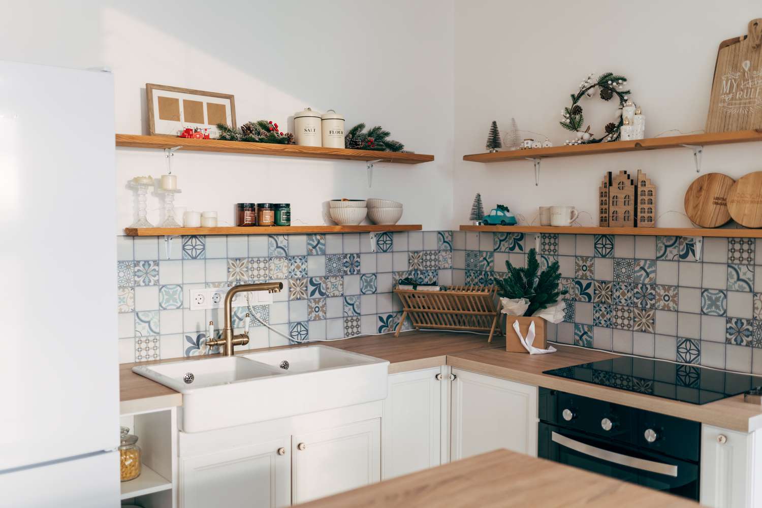 Kitchen with blue and white tile backsplash
