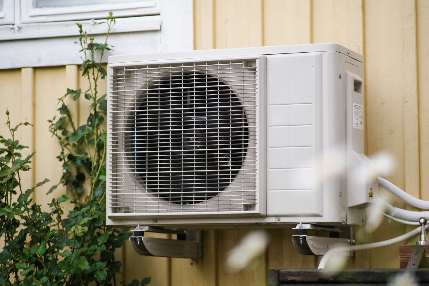 An outdoor air conditioning unit mounted on the exterior of a building
