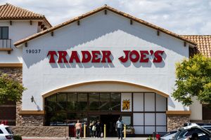 Trader Joes storefront with customers entering and exiting