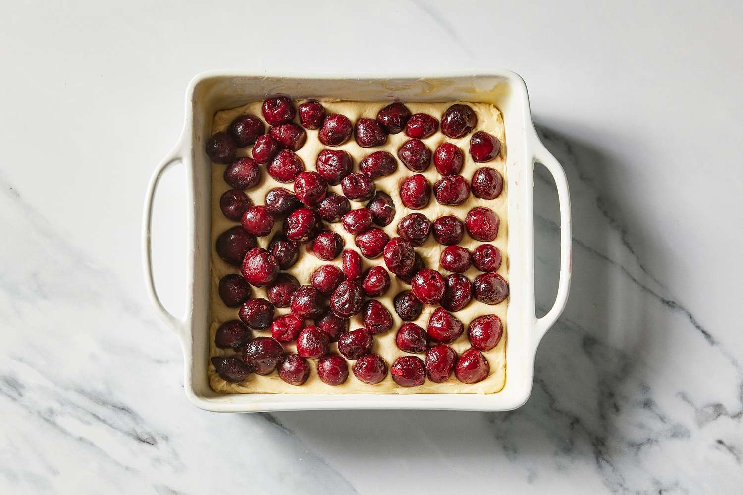 Sour Cherry Crumb Cake in pan ready to bake