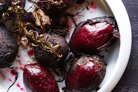 roasted beets in a dish, unpeeled