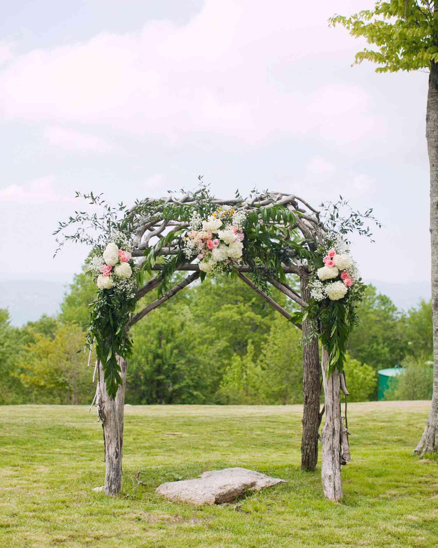 Unkempt Willow Branch Wedding Arch with Pink and Orange Flowers