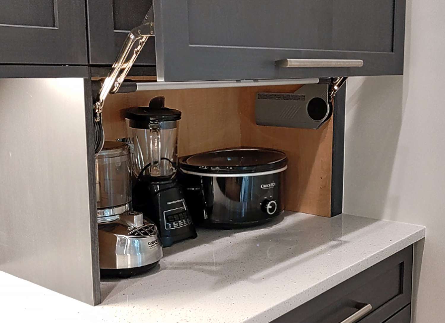 appliance garage with lift-up doors