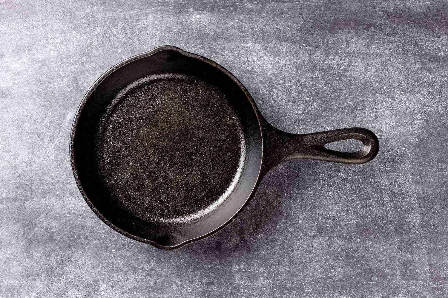 cast iron skillet on slate surface