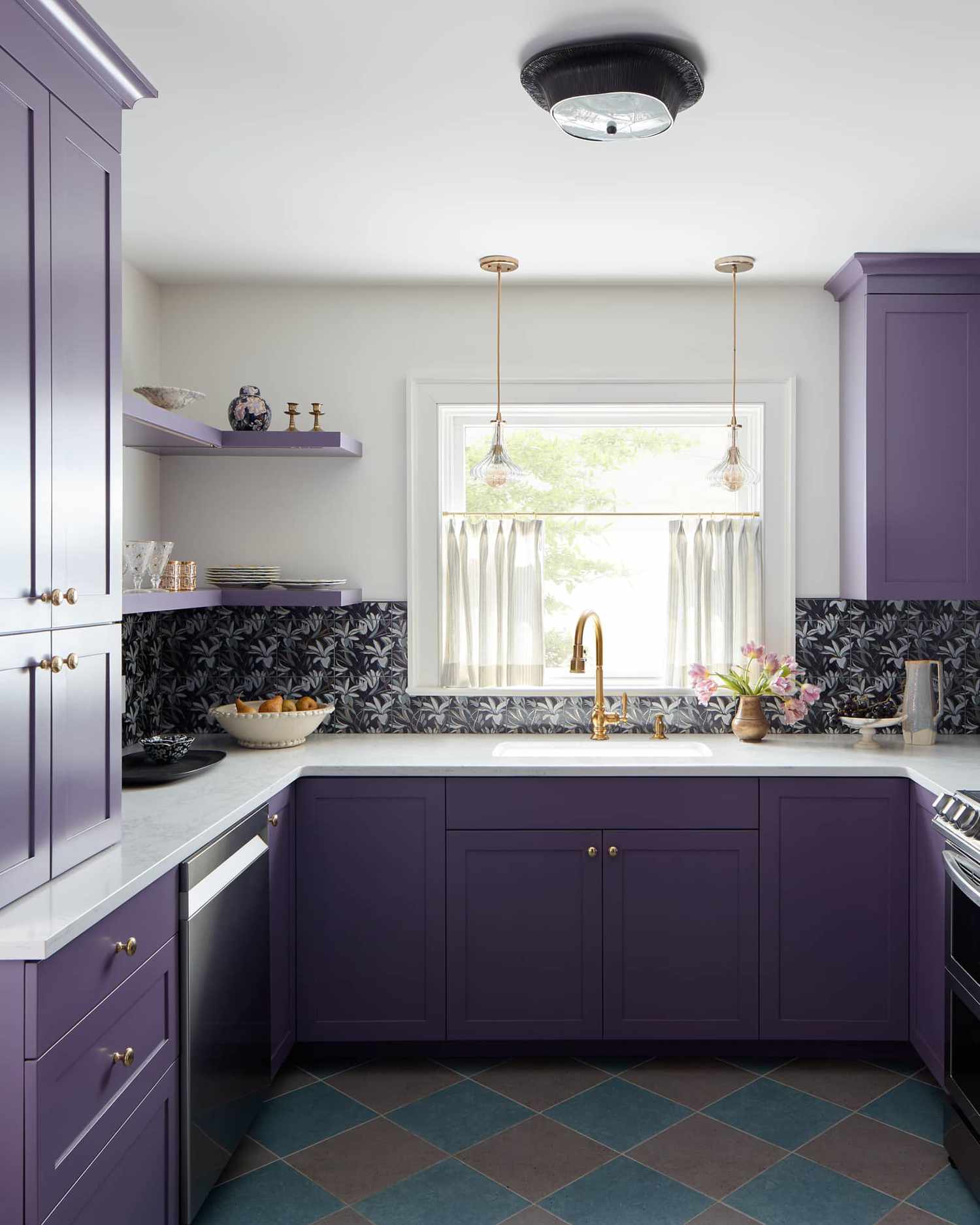 Purple kitchen with brass hardware